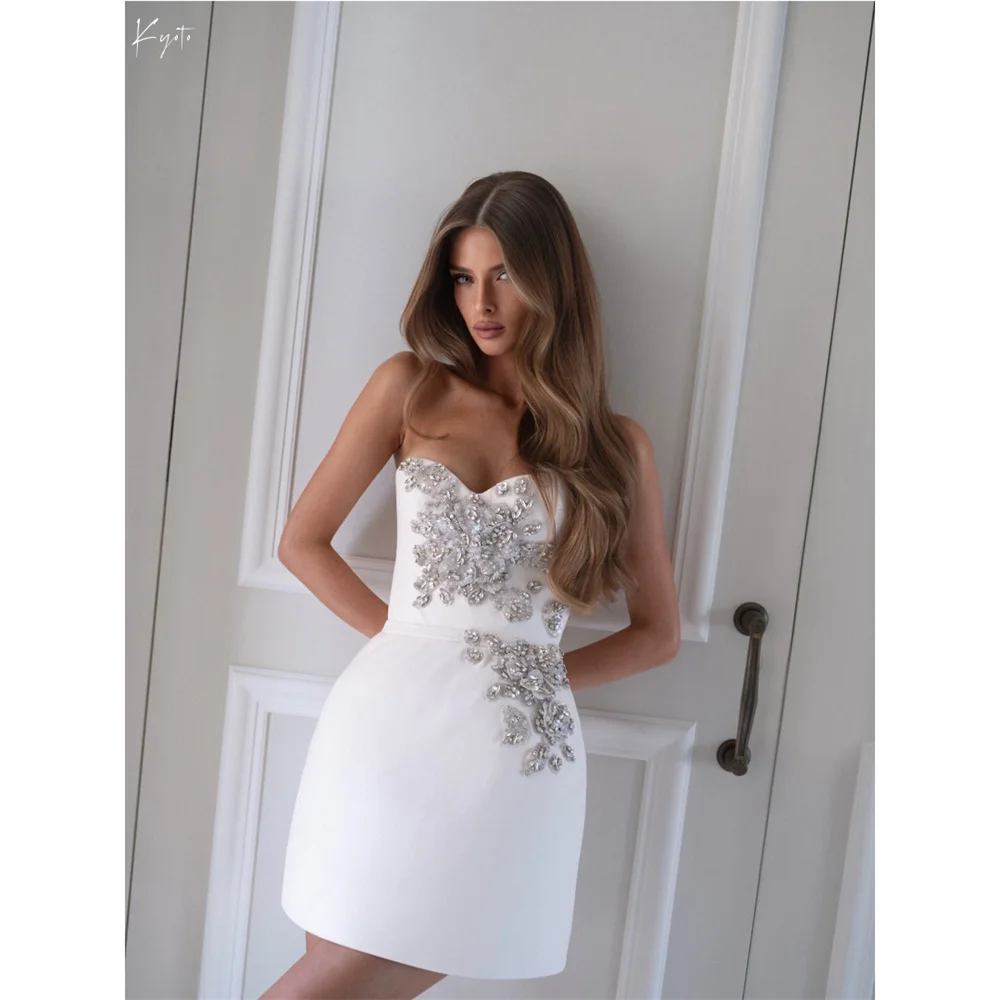 Kyoto по индивидуальному заказу белое милое роскошное свадебное платье со стразами мини без бретелек платья de noche без рукавов после вечеринки платье
Kyoto по индивидуальному заказу белое милое роскошное свадебное платье со стразами мини без бретелек платья de noche без рукавов после вечеринки платье