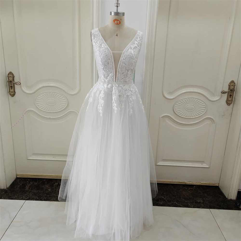 ZJ6053 Lace Appliques Pearls Tulle Wedding Dresses V-Neck Sleeveless Floor-Length Ruffled Bridal Dress Long Wedding Gowns
ZJ6053 Lace Appliques Pearls Tulle Wedding Dresses V-Neck Sleeveless Floor-Length Ruffled Bridal Dress Long Wedding Gowns