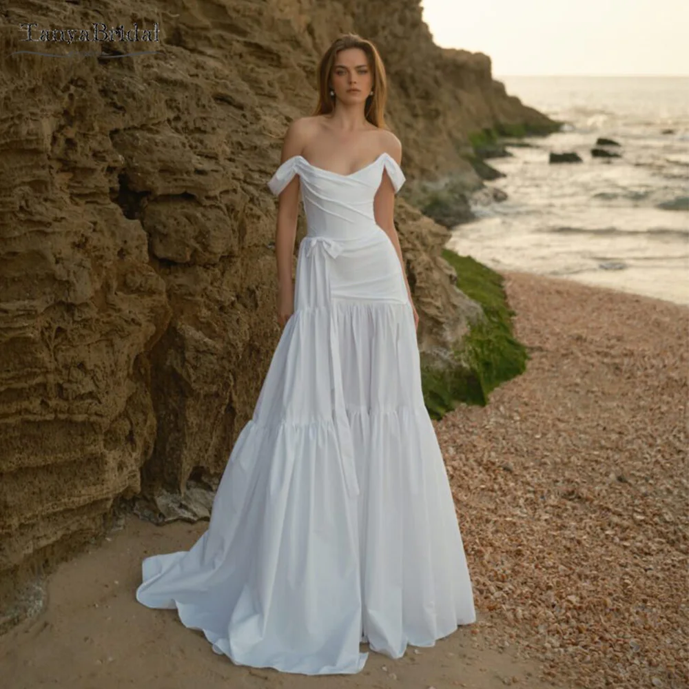 Свадебные платья трапециевидной формы с открытыми плечами и юбками с оборками, свадебные платья из тафты, шикарное платье в стиле бохо DW1037
Свадебные платья трапециевидной формы с открытыми плечами и юбками с оборками, свадебные платья из тафты, шикарное платье в стиле бохо DW1037