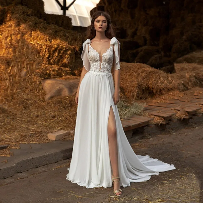 Romand Customized Sexy V-Neck Sleeveless Bow Ribbons Flower Lace Appliques A-Line Wedding Dress Bride Backless High Slit Chiffon
Romand Customized Sexy V-Neck Sleeveless Bow Ribbons Flower Lace Appliques A-Line Wedding Dress Bride Backless High Slit Chiffon