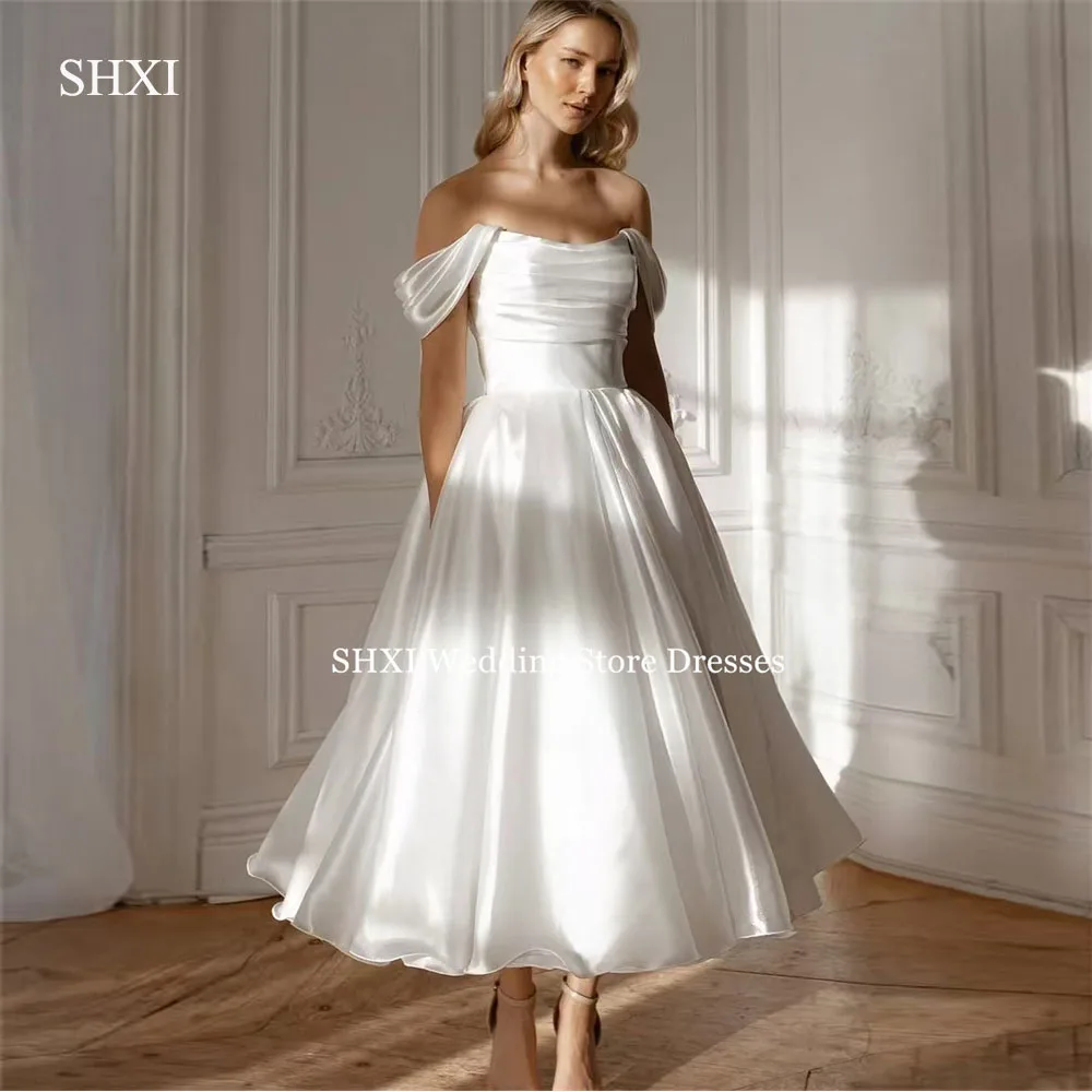 SHXI Luxury Off Shoulder Wedding Dresses Pleat Strapless Tea Length Bride Dress Princess Draped Backless Bridal Gown Customized
SHXI Luxury Off Shoulder Wedding Dresses Pleat Strapless Tea Length Bride Dress Princess Draped Backless Bridal Gown Customized