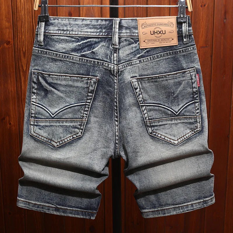 Summer men's cropped shorts with ripped patches, trendy and retro washed straight leg casual high-end denim shorts
Summer men's cropped shorts with ripped patches, trendy and retro washed straight leg casual high-end denim shorts