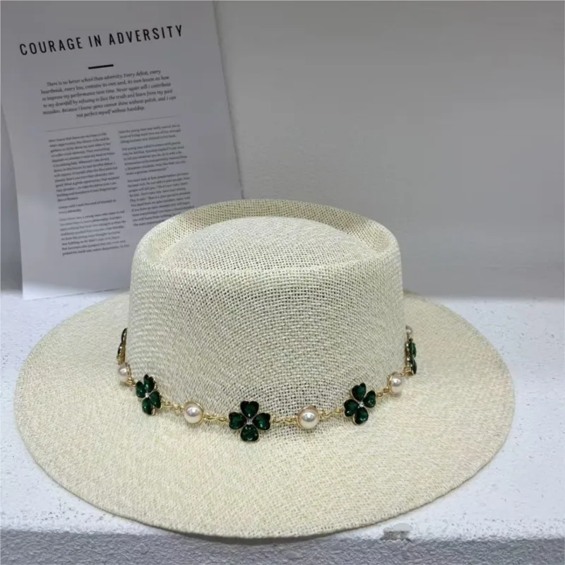 A new style of women's hat with hollowed-out flat top and weaving feel vacation-style
A new style of women's hat with hollowed-out flat top and weaving feel vacation-style