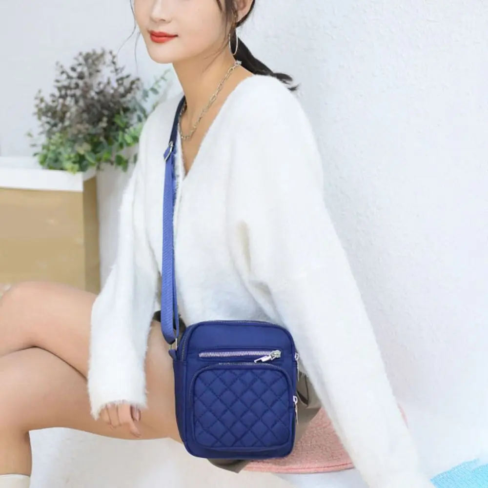 Elegant Nylon Crossbody Bag Multi-layer Grid Classic Mid-aged Shoulder Bag Casual Large Capacity Women Messenger Bag Lady
Elegant Nylon Crossbody Bag Multi-layer Grid Classic Mid-aged Shoulder Bag Casual Large Capacity Women Messenger Bag Lady