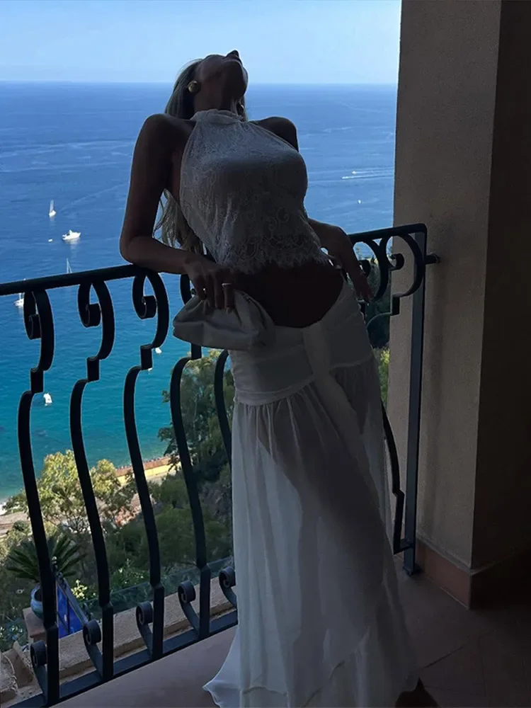 Elegant Lace Sheer Layer Women Skirt Set Halter Backless Lace Top See Through Draped Maxi Skirts 2026 Summer casual party Outfit
Elegant Lace Sheer Layer Women Skirt Set Halter Backless Lace Top See Through Draped Maxi Skirts 2026 Summer casual party Outfit