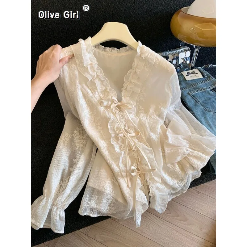 Olivegirl Women Shirt Chiffon Lotus Leaf Edge Tied V-neck Flared Sleeve Embroidered Shirt 2026 High-end Elegant Sweet Top
Olivegirl Women Shirt Chiffon Lotus Leaf Edge Tied V-neck Flared Sleeve Embroidered Shirt 2026 High-end Elegant Sweet Top