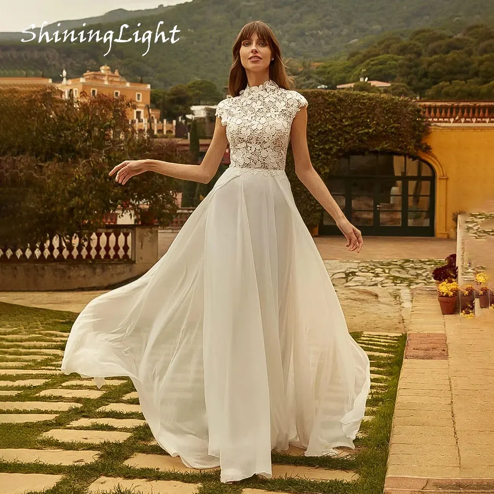 ShiningLight A-Line Bohemian Wedding Dress 2026 Lace Appliques Backless Simple Elegant Chiffon Bride Gowns Cap Sleeve Customized
ShiningLight A-Line Bohemian Wedding Dress 2026 Lace Appliques Backless Simple Elegant Chiffon Bride Gowns Cap Sleeve Customized