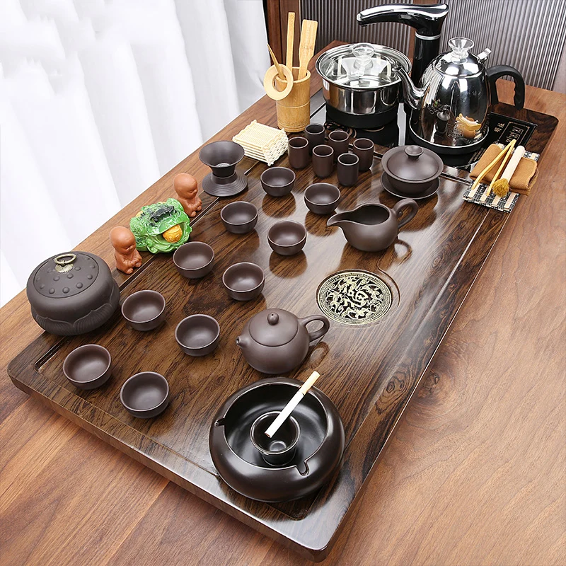 Luxury Gong Fu Tea Set Complete Yixing Puer Ceremony Chinese Traditional Teaware Sets Teapot Serving Tray Teteras Dining Set
Luxury Gong Fu Tea Set Complete Yixing Puer Ceremony Chinese Traditional Teaware Sets Teapot Serving Tray Teteras Dining Set