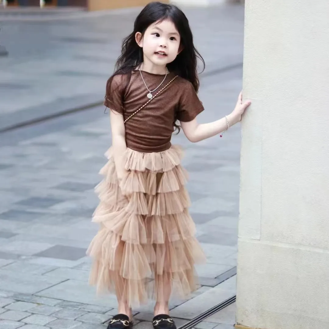 Girls' Summer 2026 new set Korean version children's coffee color leak back top+cake skirt two-piece set
Girls' Summer 2026 new set Korean version children's coffee color leak back top+cake skirt two-piece set