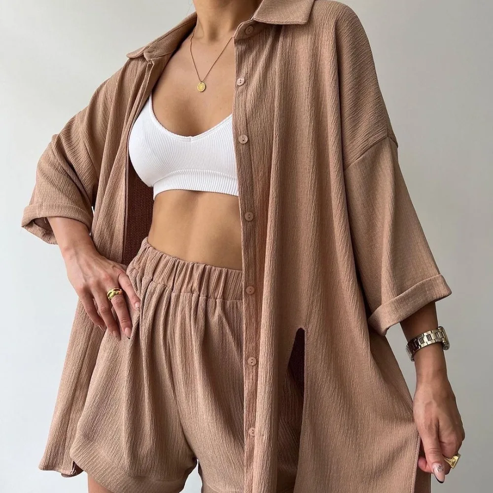 2026 Women's New Summer Personalized Split Sleeve Shirt Shorts Solid Color Set Fashionable Casual Two Piece Sets
2026 Women's New Summer Personalized Split Sleeve Shirt Shorts Solid Color Set Fashionable Casual Two Piece Sets