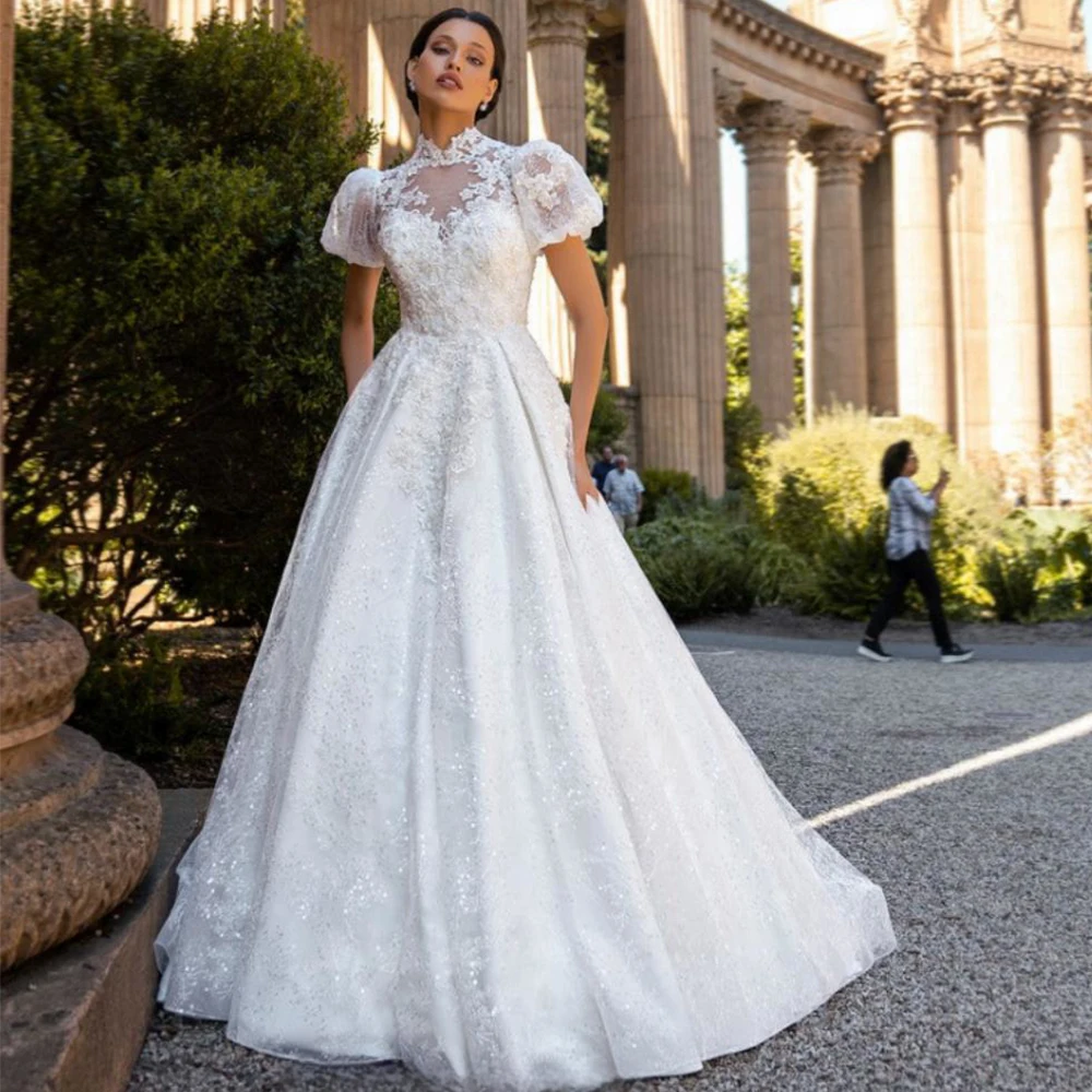 Luxury Glitter High Neck Puff Sleeves Wedding Dress Illusion Tulle Applique Floor Length A-Line Vintage Customized Bride Gown
Luxury Glitter High Neck Puff Sleeves Wedding Dress Illusion Tulle Applique Floor Length A-Line Vintage Customized Bride Gown