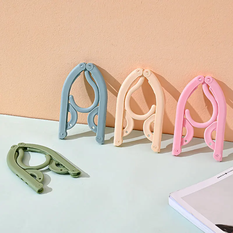 Portable Magic Folding Travel Hanger Plastic Clothes Drying Rack Multifunctional Student Dormitory Essential Tie Use Injection
Portable Magic Folding Travel Hanger Plastic Clothes Drying Rack Multifunctional Student Dormitory Essential Tie Use Injection