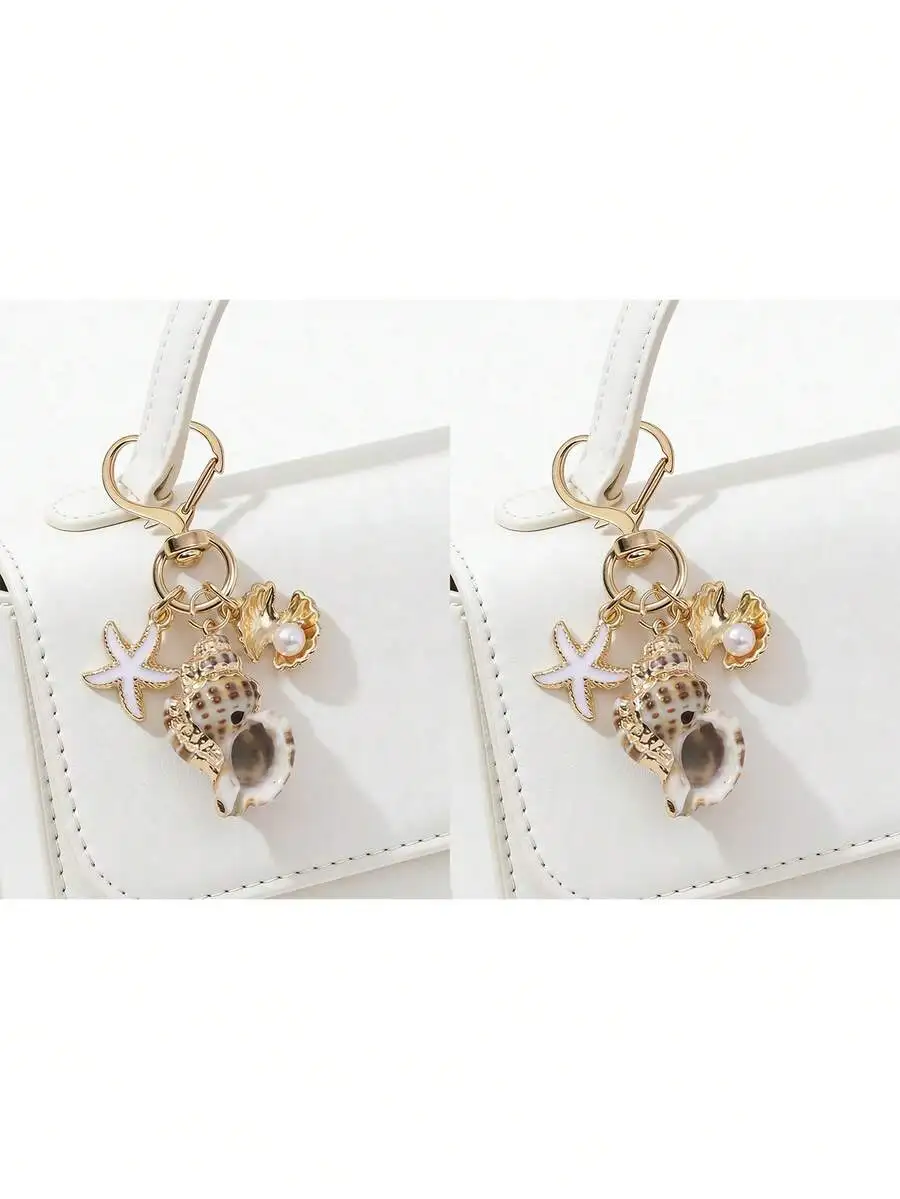 Asymmetrical shell starfish conch pendant with heart-shaped buckle wallet charm beach vacation keychain summer accessory for wom
Asymmetrical shell starfish conch pendant with heart-shaped buckle wallet charm beach vacation keychain summer accessory for wom