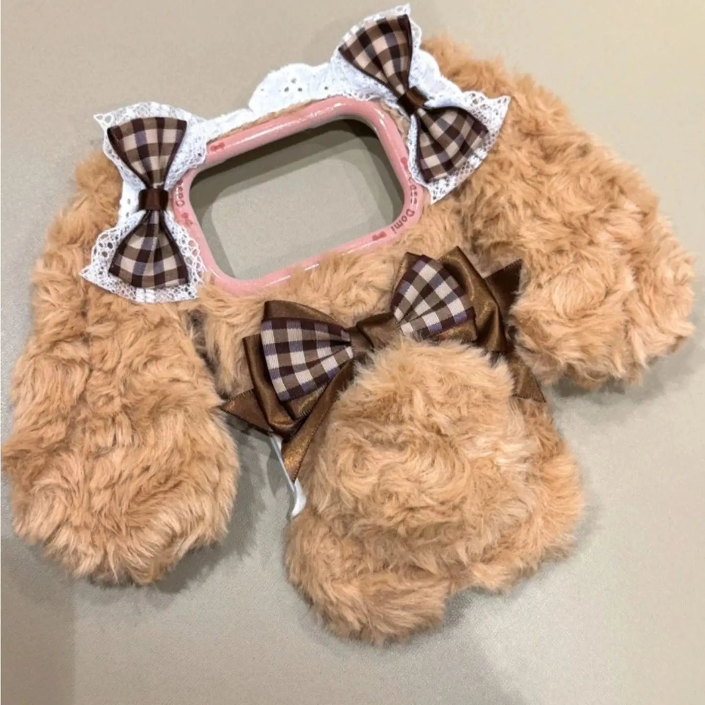 Soft And Cute Brown Plush Rabbit With A Dangling Ear And Bow-Shaped Ears. Suitable For iPhone 17, 16, 15, 14, 13 Pro Max.
Soft And Cute Brown Plush Rabbit With A Dangling Ear And Bow-Shaped Ears. Suitable For iPhone 17, 16, 15, 14, 13 Pro Max.