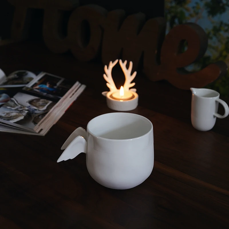 Nordic Ceramic Wing Shape Mug Ornaments Living Room Kitchen Office Tabletop Coffee Cup Handicraft Home Decoration Accessories
Nordic Ceramic Wing Shape Mug Ornaments Living Room Kitchen Office Tabletop Coffee Cup Handicraft Home Decoration Accessories