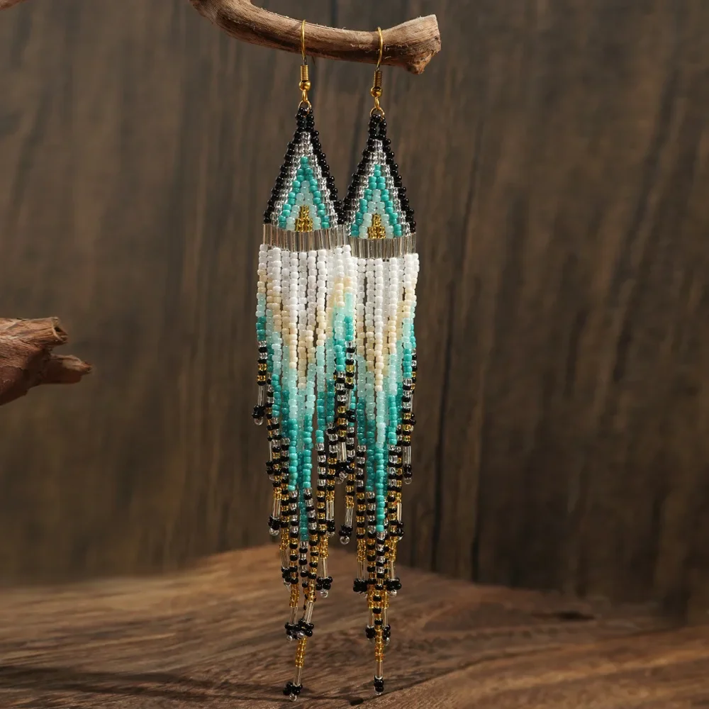 Rice bead earrings Tassel Gradient Originality Hand knitting Bohemia Alloy Fashion Simple Beaded earrings
Rice bead earrings Tassel Gradient Originality Hand knitting Bohemia Alloy Fashion Simple Beaded earrings