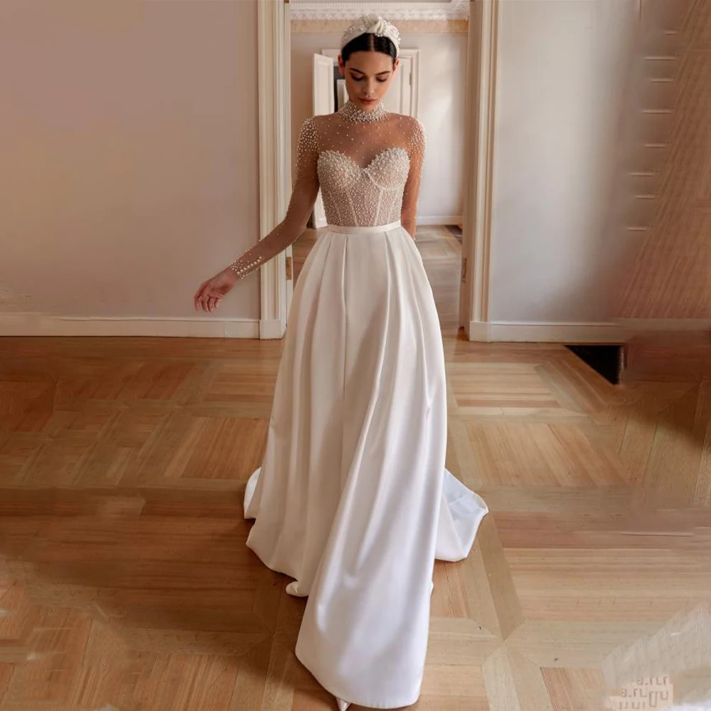 Shiny High Neck Full Sleeves Beaded Satjn A Line Wedding Dresses Custom Made Bridal Grown 2025 Rode De Morrie
Shiny High Neck Full Sleeves Beaded Satjn A Line Wedding Dresses Custom Made Bridal Grown 2025 Rode De Morrie