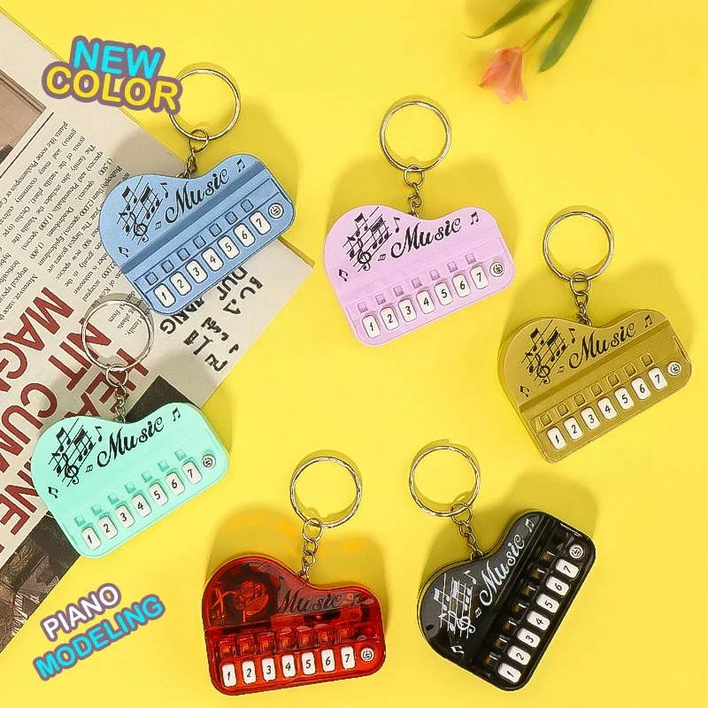 Creative luminous keyring toy piano player Music master mini children's electronic organ video game console
Creative luminous keyring toy piano player Music master mini children's electronic organ video game console