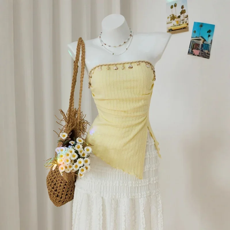 Женский летний сладкий желтый облегающий вязаный топ-труба с украшением из ракушки и ленты, нерегулярный плиссированный повседневный топ с боковым разрезом для отпуска 
Женский летний сладкий желтый облегающий вязаный топ-труба с украшением из ракушки и ленты, нерегулярный плиссированный повседневный топ с боковым разрезом для отпуска