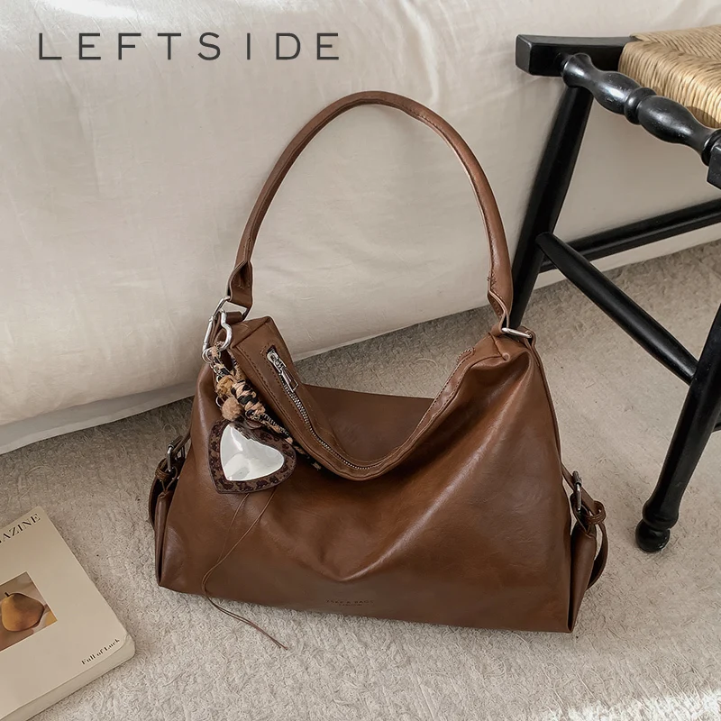 Левая сторона, модная классическая сумка, мягкая кожаная сумка-тоут с подвеской в виде сердца, минималистичная новинка 2025 года, сумка на плечо для женщин, повседневная элегантность
Левая сторона, модная классическая сумка, мягкая кожаная сумка-тоут с подвеской в виде сердца, минималистичная новинка 2025 года, сумка на плечо для женщин, повседневная элегантность