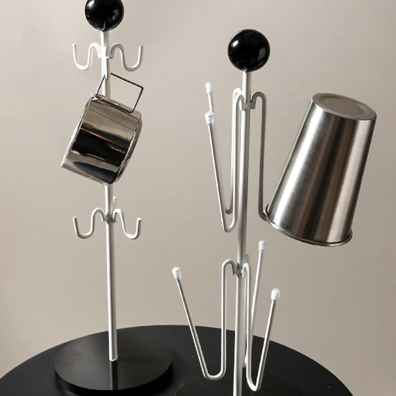 Металлическая подставка для хранения кофейных чашек в форме дерева, подвесная подставка для чашек, подставка для напитков, 6 крючков
Металлическая подставка для хранения кофейных чашек в форме дерева, подвесная подставка для чашек, подставка для напитков, 6 крючков