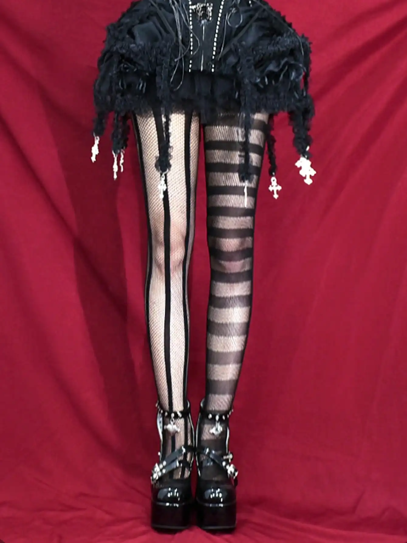 Asymmetrical Black Fishnet Stockings with Striped Mesh Panels and Cross Charms
Asymmetrical Black Fishnet Stockings with Striped Mesh Panels and Cross Charms