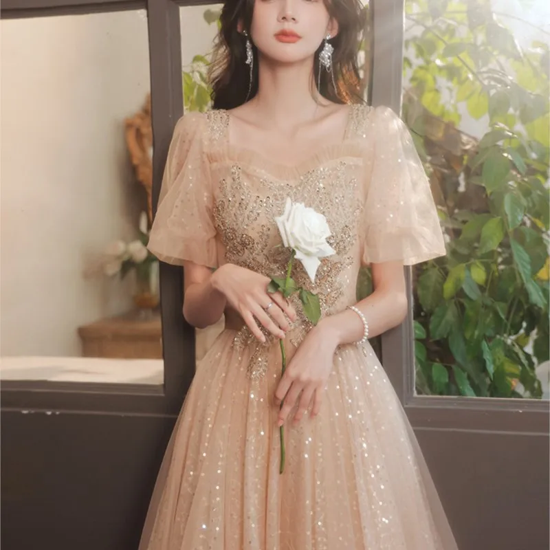 Champagne-colored banquet style short-sleeved light luxury niche host art examination dress
Champagne-colored banquet style short-sleeved light luxury niche host art examination dress