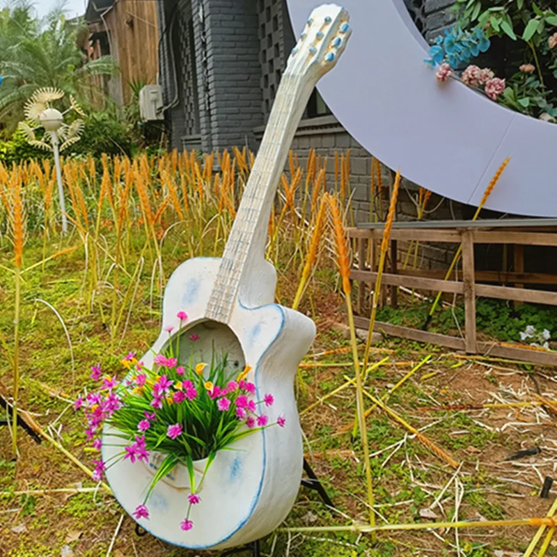 Balcony garden outdoor decoration, creative store entrance arrangement, guitar flower pot retro old piano gardening landscape
Balcony garden outdoor decoration, creative store entrance arrangement, guitar flower pot retro old piano gardening landscape