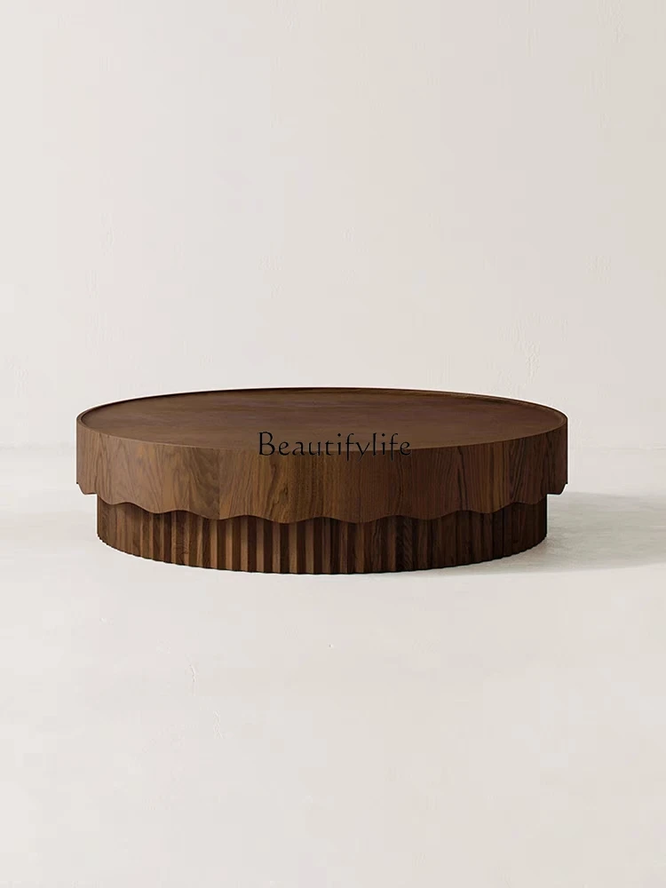 Italian minimalist round coffee table simple new Chinese furniture solid wood round tea table
Italian minimalist round coffee table simple new Chinese furniture solid wood round tea table