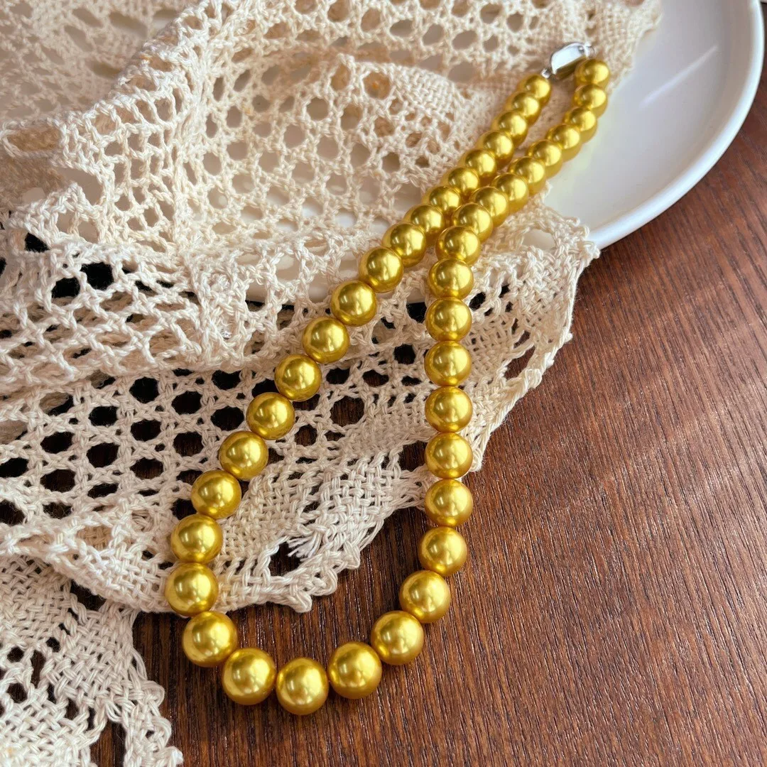Warm gold 10mm high quality Shijia pearl thick gold simple short neck chain Nanyang gold bead collarbone chain women
Warm gold 10mm high quality Shijia pearl thick gold simple short neck chain Nanyang gold bead collarbone chain women