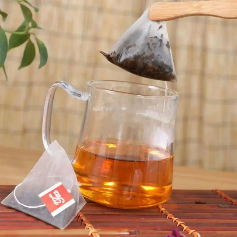 C 100Pcs new Disposable Triangle Tea Bag Nylon Pouch Empty Tea Infuser Spice Coffee Drawstring Bag Seal Food Grade Tea Strainer
C 100Pcs new Disposable Triangle Tea Bag Nylon Pouch Empty Tea Infuser Spice Coffee Drawstring Bag Seal Food Grade Tea Strainer