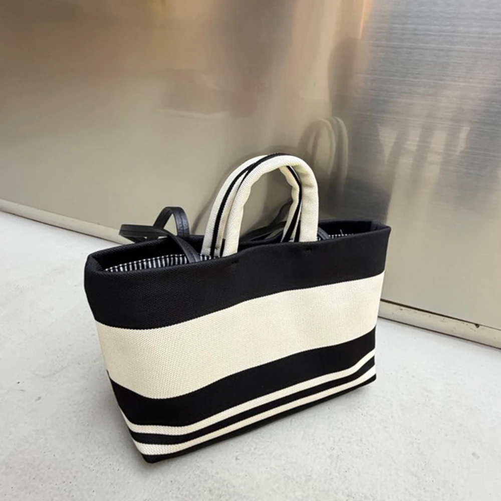 Модная дизайнерская полосатая сумка-тоут для женщин, высококачественная холщовая сумка через плечо, повседневная сумка-шоппер, сумка-ведро для поездок на работу
Модная дизайнерская полосатая сумка-тоут для женщин, высококачественная холщовая сумка через плечо, повседневная сумка-шоппер, сумка-ведро для поездок на работу