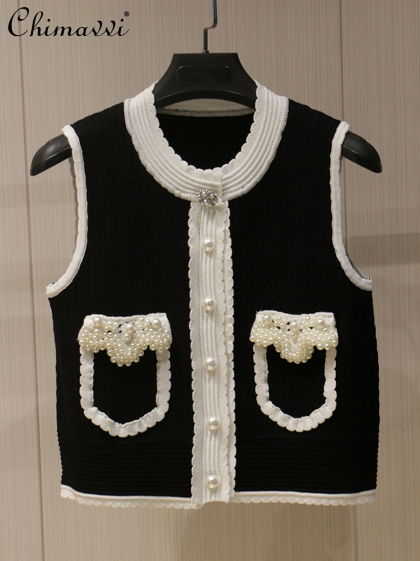 Heavy Pearl Jewelry Black and White Contrasting Color Crew Neck Sleeveless Knitted Cardigan Vest Summer New Fashion Vest Top
Heavy Pearl Jewelry Black and White Contrasting Color Crew Neck Sleeveless Knitted Cardigan Vest Summer New Fashion Vest Top