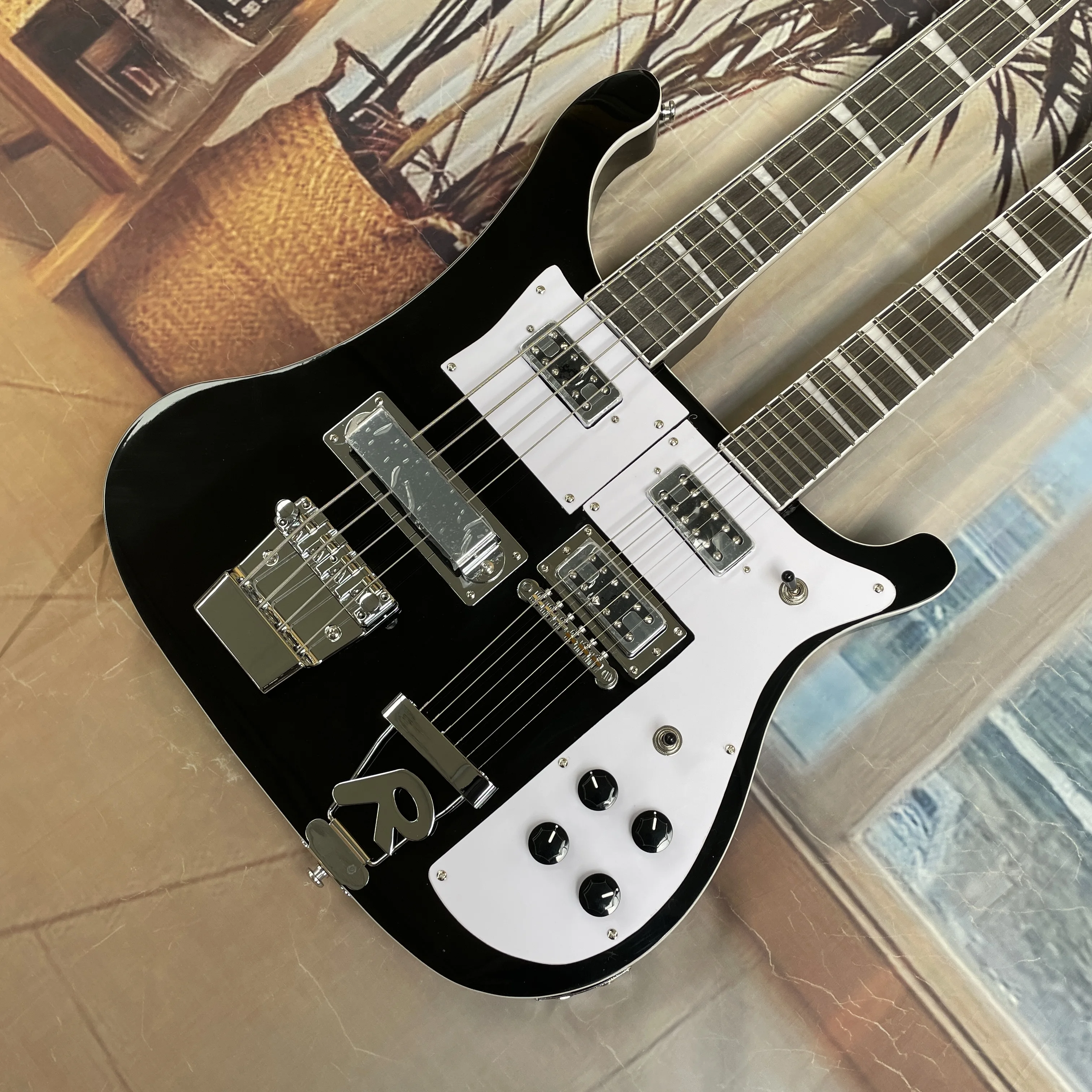 High-end black double-neck electric bassguitar with white pickguard black knobs guitas.specially designed for rock musicguitarra
High-end black double-neck electric bassguitar with white pickguard black knobs guitas.specially designed for rock musicguitarra