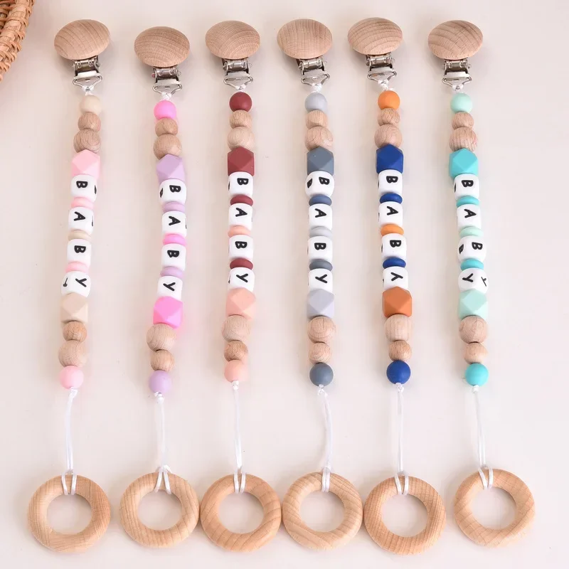 2pcs INS Baby Personalized Name Pacifiers Clips Wooden Ring Teething Toy Dummy Nipple Holder Chain Silicone BPA Free Accessories 
2pcs INS Baby Personalized Name Pacifiers Clips Wooden Ring Teething Toy Dummy Nipple Holder Chain Silicone BPA Free Accessories