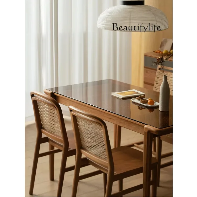 Simple modern black walnut rattan dining table backrest chair household small apartment retro solid wood dining chair
Simple modern black walnut rattan dining table backrest chair household small apartment retro solid wood dining chair