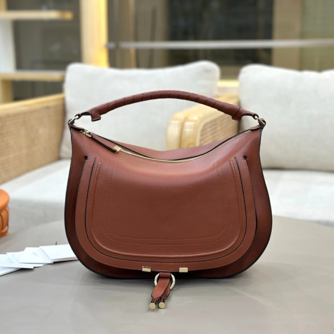 Классическая сумка-седло из натуральной кожи, вместительная сумка через плечо из воловьей кожи, сумка-кроссбоди для женщин, модная женская сумочка
Классическая сумка-седло из натуральной кожи, вместительная сумка через плечо из воловьей кожи, сумка-кроссбоди для женщин, модная женская сумочка