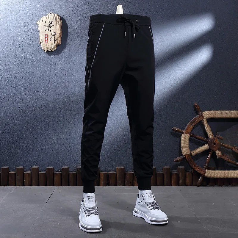 Летние тонкие ледяные шелковые прохладные и дышащие эластичные облегающие повседневные спортивные брюки с буквенным принтом для маленьких ног для мужчин 
Летние тонкие ледяные шелковые прохладные и дышащие эластичные облегающие повседневные спортивные брюки с буквенным принтом для маленьких ног для мужчин