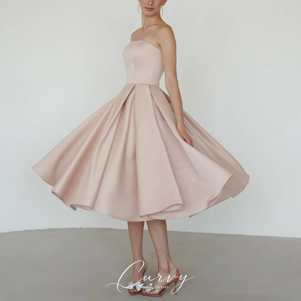 Curvy Soft Feminine Strapless A-Line Wedding Dresses for Women Blush Satin with Corset Back Functional Pockets Customized 2026
Curvy Soft Feminine Strapless A-Line Wedding Dresses for Women Blush Satin with Corset Back Functional Pockets Customized 2026