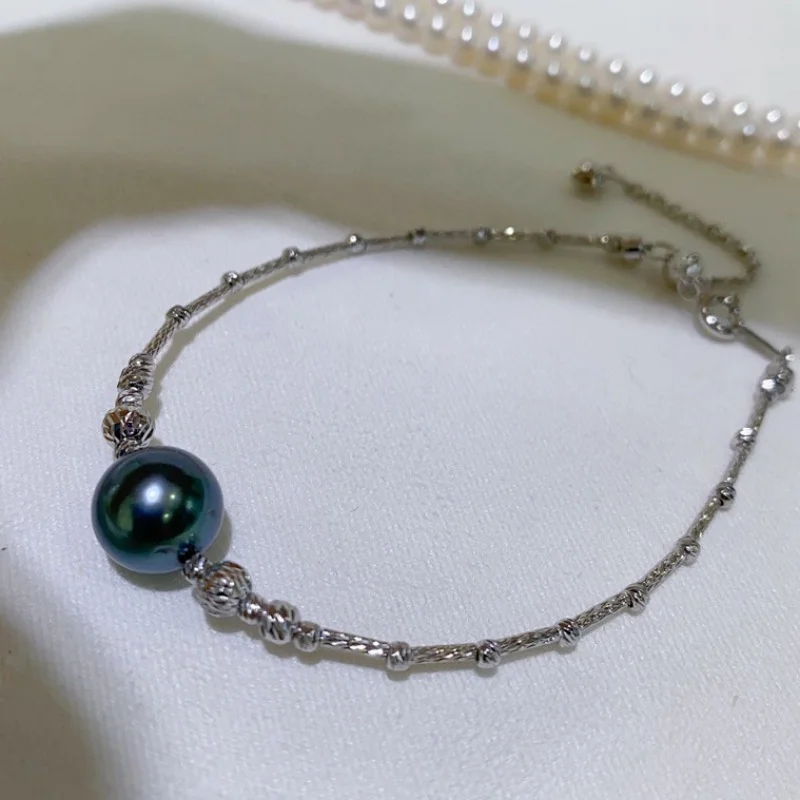 SGARIT Роскошный редкий натуральный 9-10 мм таитянский натуральный черный браслет с круглым жемчугом для женщин, цепочка из чистого серебра 925 s с ананасом
SGARIT Роскошный редкий натуральный 9-10 мм таитянский натуральный черный браслет с круглым жемчугом для женщин, цепочка из чистого серебра 925 s с ананасом