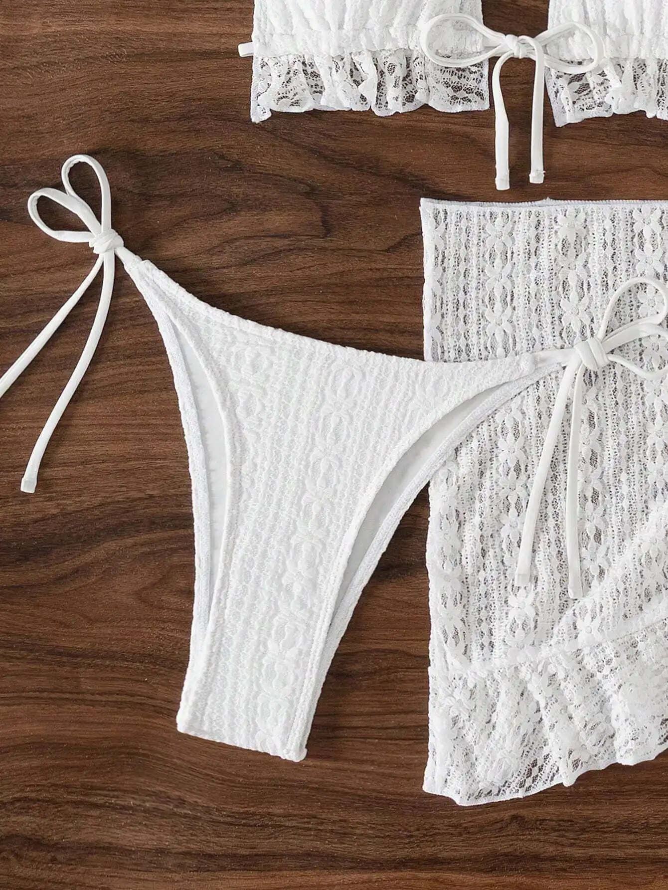 White Lace Ruffle Hem Halter Bikini Set With Cover Up Skirt
White Lace Ruffle Hem Halter Bikini Set With Cover Up Skirt