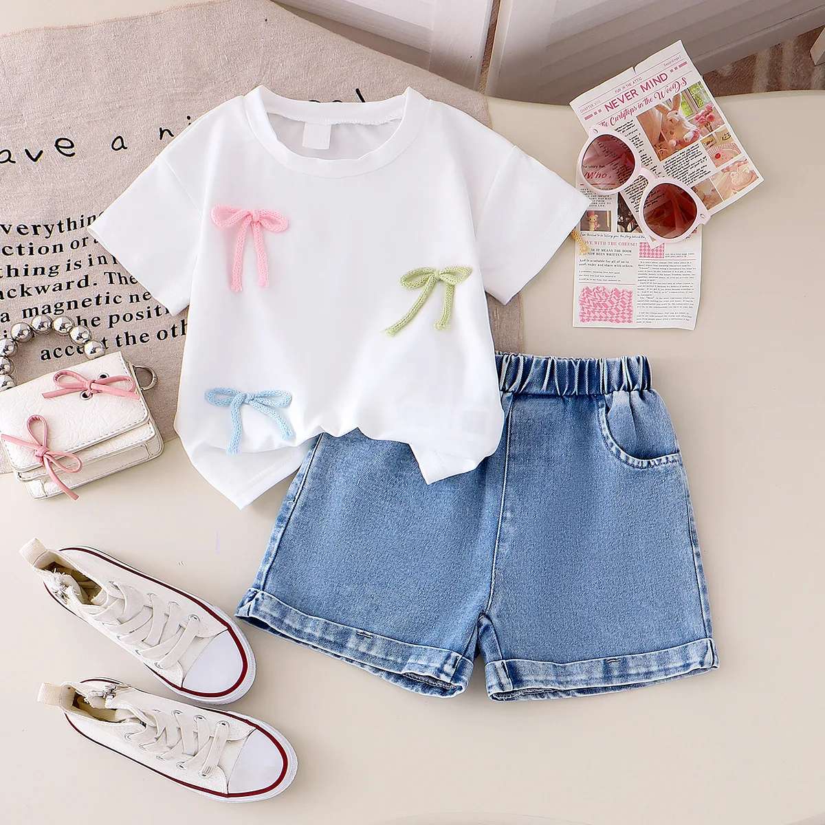 Girls EuropeAn-American style summer solid color round neck stereoscopic bow short-sleeved blouse denim shorts two-piece set
Girls EuropeAn-American style summer solid color round neck stereoscopic bow short-sleeved blouse denim shorts two-piece set