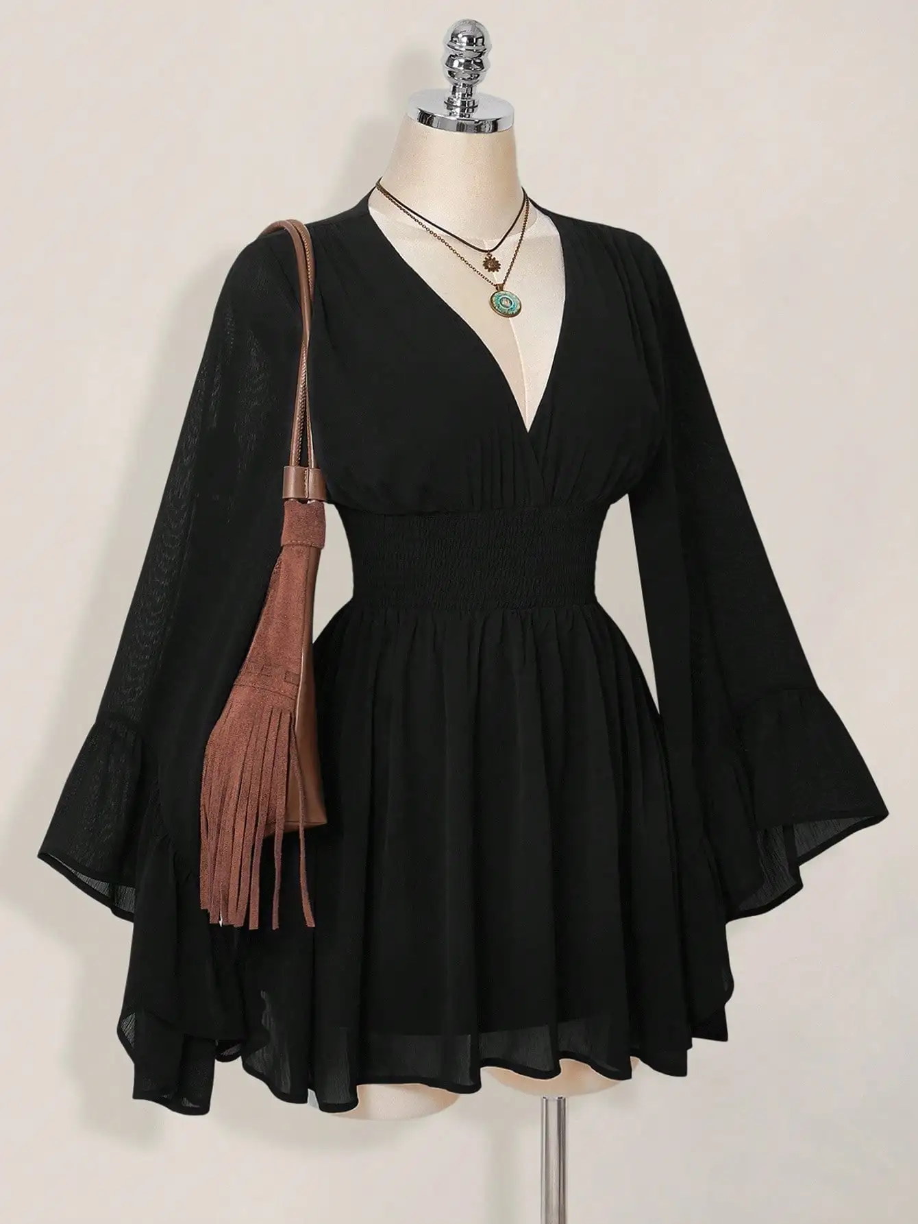 Black V-Neck Long Sleeve Mini Dress with Bell Sleeves and Smocked Waist
Black V-Neck Long Sleeve Mini Dress with Bell Sleeves and Smocked Waist