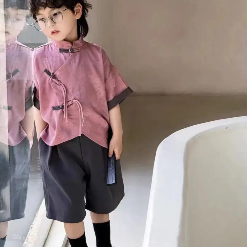 New Chinese style Boys' Buckle Stand up Collar Short Sleeve Shirt Children's 2026 Summer Fashion Top Pants 2-piece Set LJ703
New Chinese style Boys' Buckle Stand up Collar Short Sleeve Shirt Children's 2026 Summer Fashion Top Pants 2-piece Set LJ703