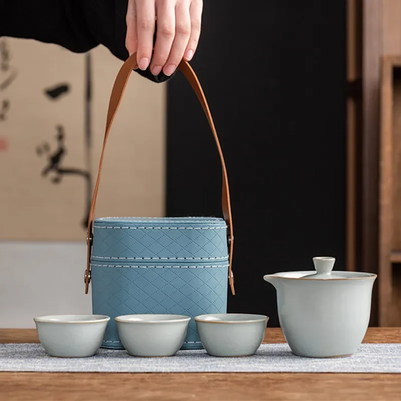 Celadon Ice-cracked Glaze Ceramic Teapot and Cup Set Outdoor Portable Travel Tea Set A Pot of Three Cups Storage Bag Set
Celadon Ice-cracked Glaze Ceramic Teapot and Cup Set Outdoor Portable Travel Tea Set A Pot of Three Cups Storage Bag Set