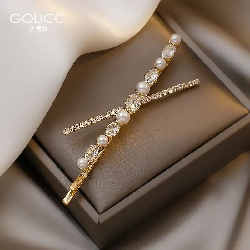 Cross pearl hairpin female Korean ins simple temperament bangs top clip girl side clip hairpin clip head jewelry
Cross pearl hairpin female Korean ins simple temperament bangs top clip girl side clip hairpin clip head jewelry
