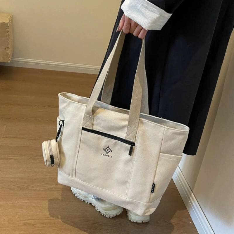Thickened and Densified Canvas Bags for Women's Work, Travel, School Outings, Handheld Shoulder Bag with Mini Round Coin Purse
Thickened and Densified Canvas Bags for Women's Work, Travel, School Outings, Handheld Shoulder Bag with Mini Round Coin Purse