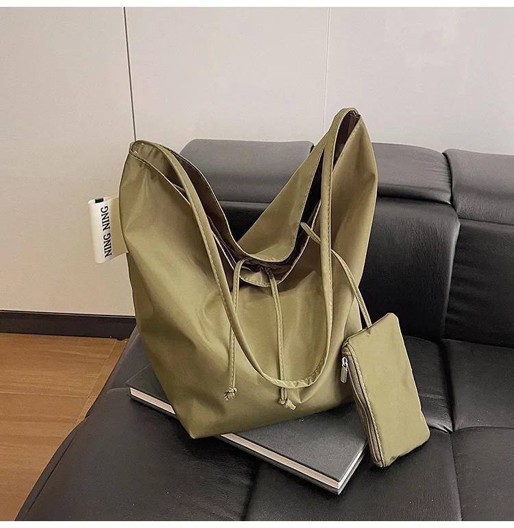 New women's large capacity single shoulder canvas light luxury niche tote bag, versatile for work and commuting
New women's large capacity single shoulder canvas light luxury niche tote bag, versatile for work and commuting