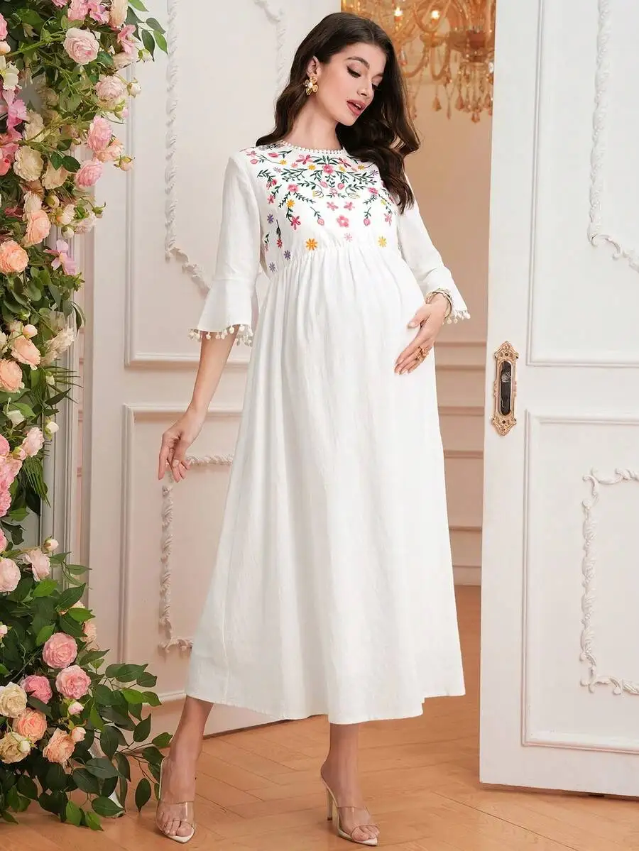 Maternity Dress With Floral Embroidery And Pom Pom Cuff, Mid-Sleeve Bell Sleeve, A-Line Cotton Long Dress
Maternity Dress With Floral Embroidery And Pom Pom Cuff, Mid-Sleeve Bell Sleeve, A-Line Cotton Long Dress