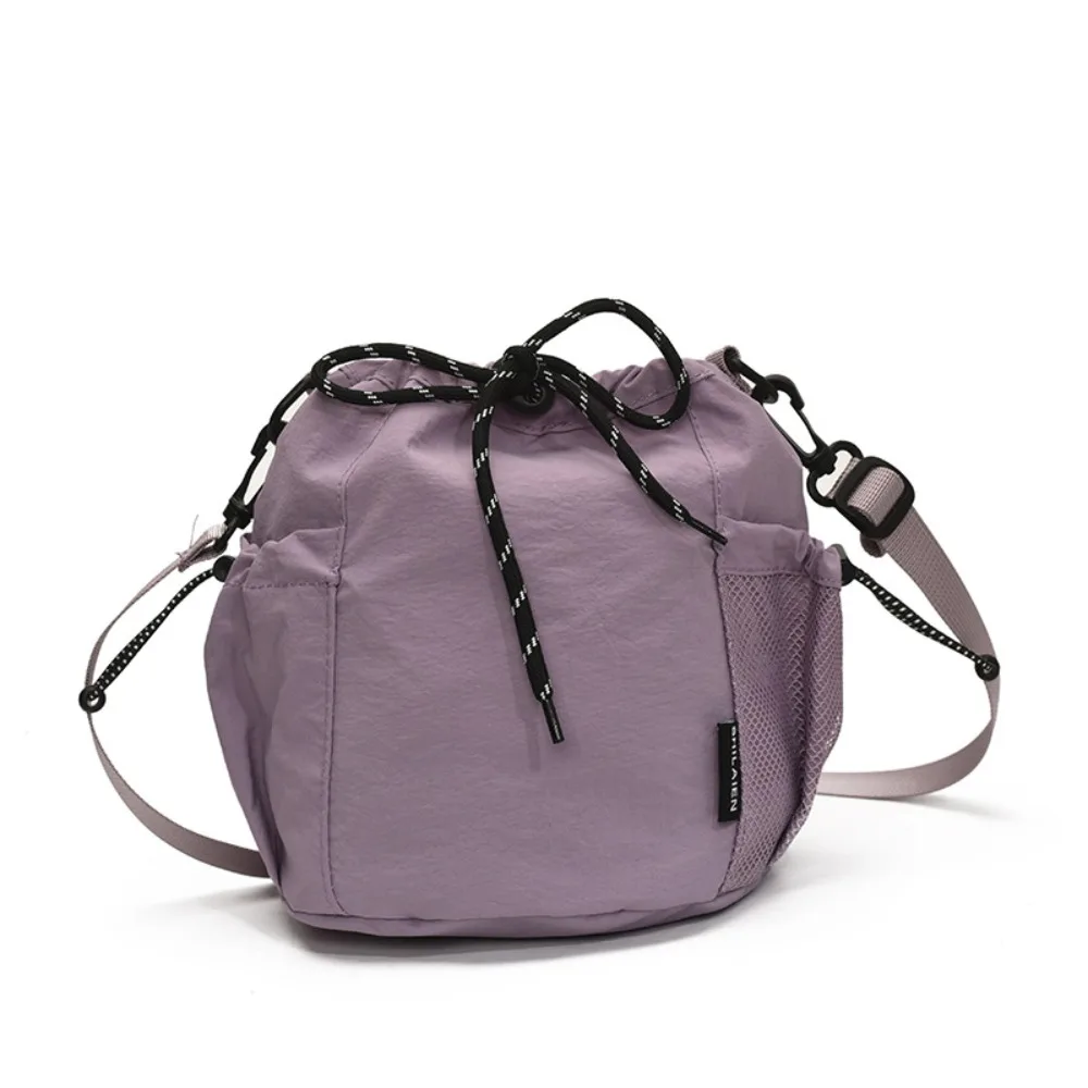 Korean Style Drawstring Bucket Bag Handbag Purse Nylon Shoulder Bag Solid Color Mobile Phone Bag Small Crossbody Bag
Korean Style Drawstring Bucket Bag Handbag Purse Nylon Shoulder Bag Solid Color Mobile Phone Bag Small Crossbody Bag